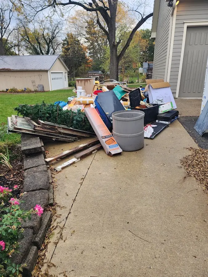 Dumpster being loaded with debris for Roofing Dumpster Rental in Silverton